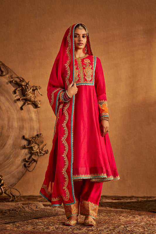 Woman in Rani Pink Kalidar Set with embroidery, traditional South Asian attire, full length