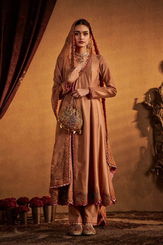 Woman in Chestnut Brown Kalidar Set, embroidered traditional South Asian attire, full length.