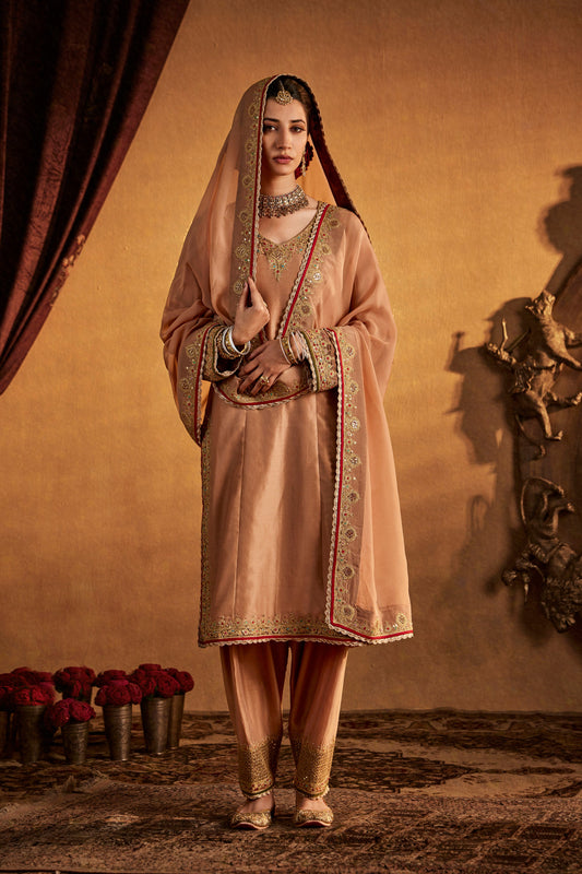 Woman in Soft Beige Kurta Set, elegant ethnic wear, traditional South Asian fashion, full length.
