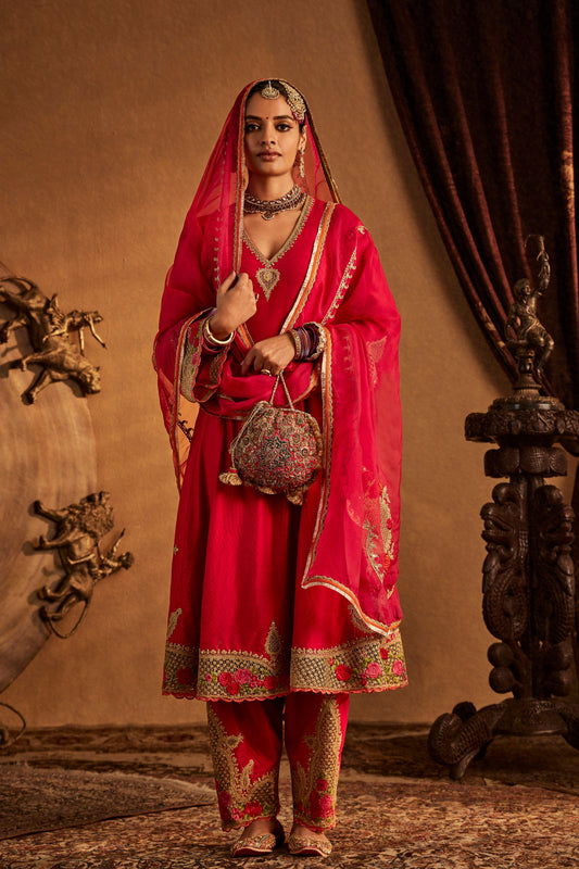 Woman in deep pink Mughal Jaali Kurta Set, ornate traditional South Asian attire, full length