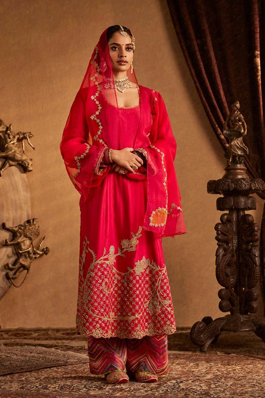 Woman in Rani Pink Kurta Set with patterned pants, elegant South Asian ethnic wear, full length