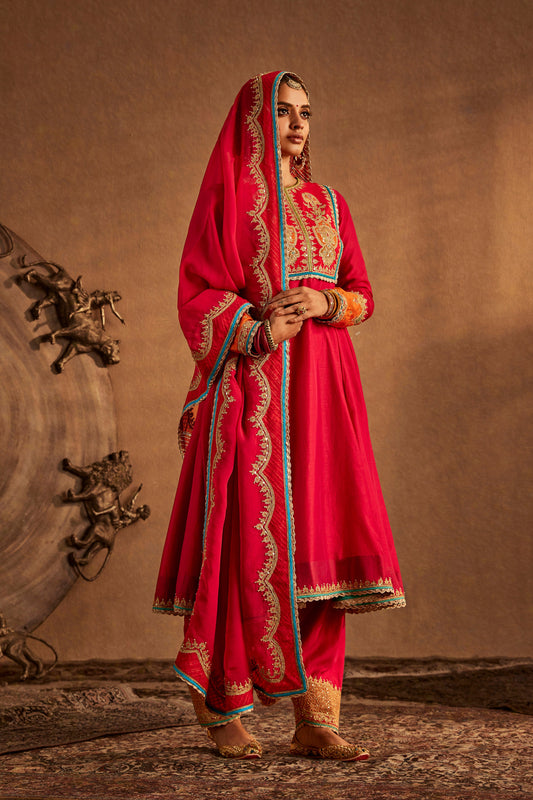 Woman in Rani Pink Kalidar Set with embroidery, traditional South Asian attire, full length