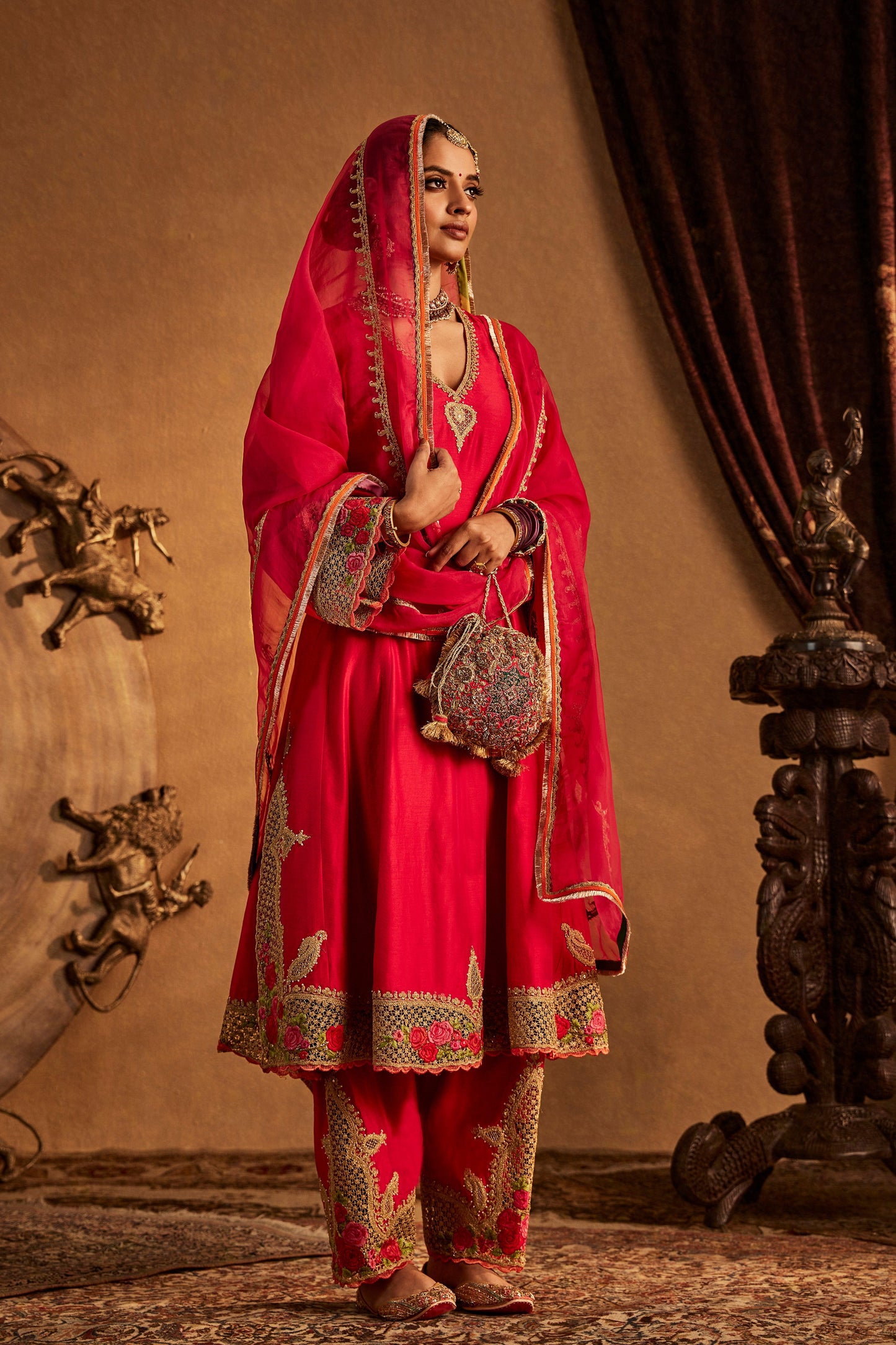 Woman in deep pink Mughal Jaali Kurta Set, ornate traditional South Asian attire, full length
