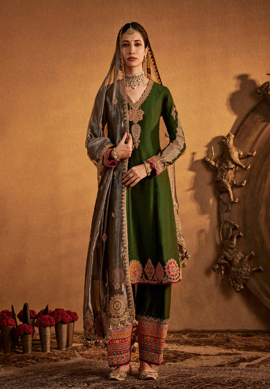 Graceful olive green Rimple and Harpreet bridal lehenga with silver embroidered dupatta, perfect for intimate festive weddings.