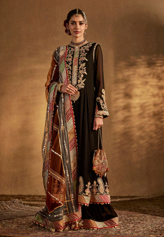 Elegant black embroidered ethnic dress with traditional dupatta and potli bag, perfect for festive and wedding occasions.