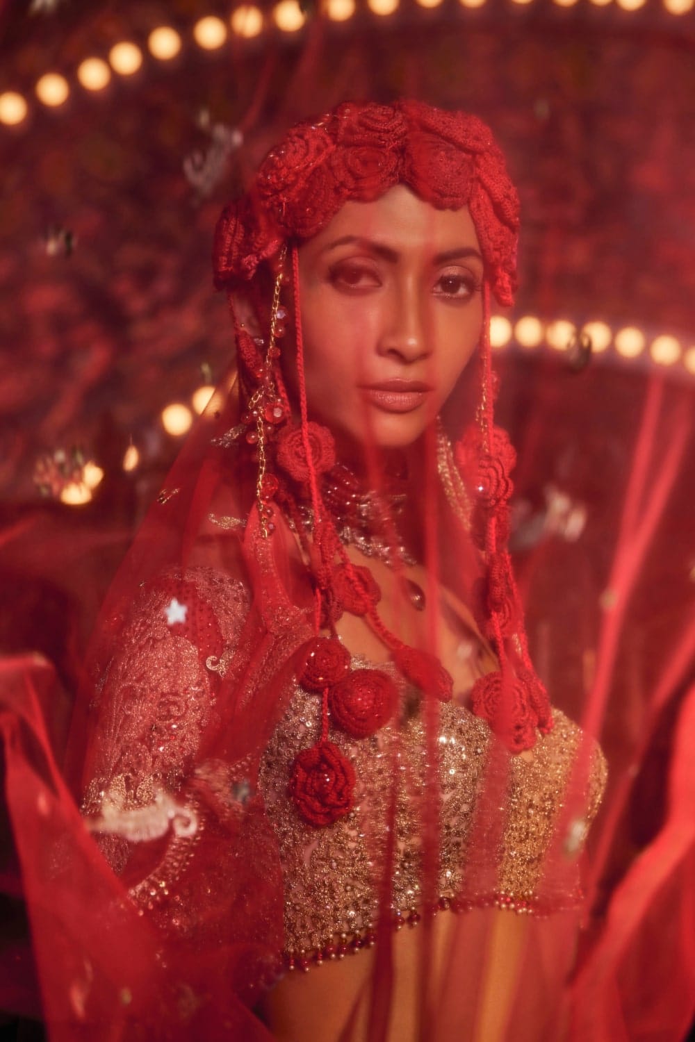 Deep Red Cutwork Lehenga with motifs comprising of bejewelled peacocks and floral vines