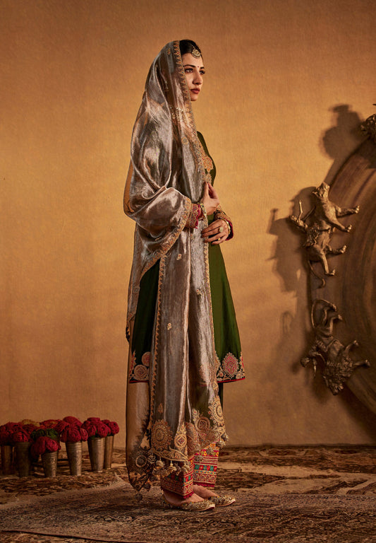 Graceful olive green Rimple and Harpreet bridal lehenga with silver embroidered dupatta, perfect for intimate festive weddings.