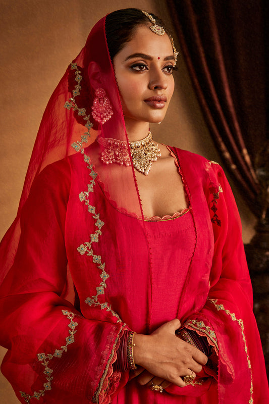 Woman in Rani Pink Kurta Set with patterned pants, elegant South Asian ethnic wear, full length